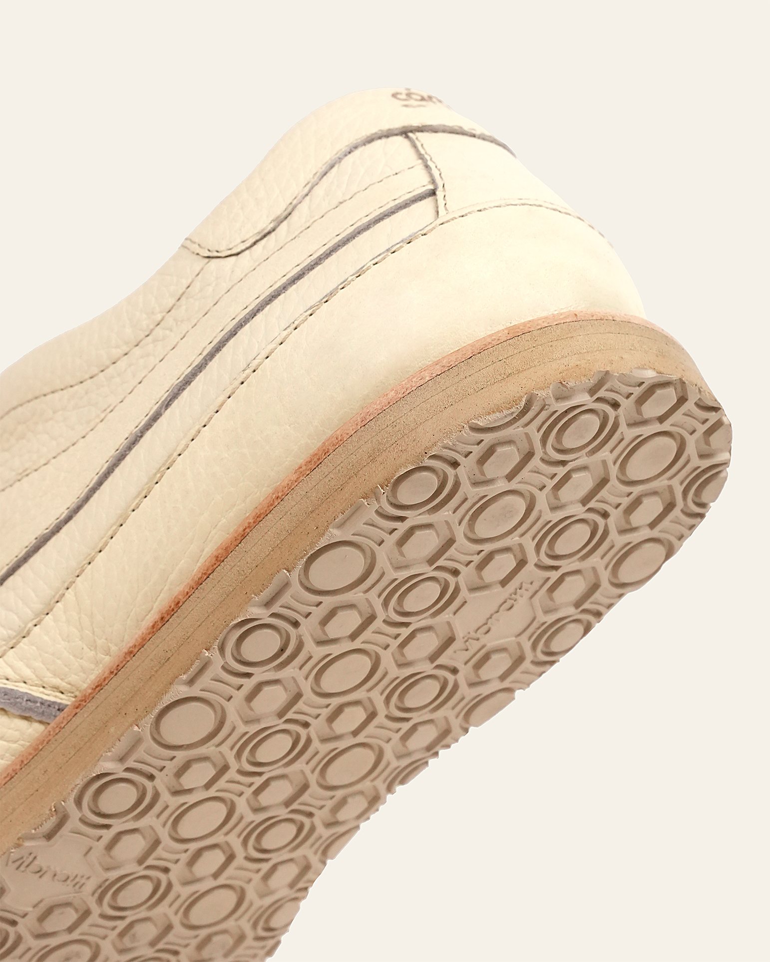 Close detail of the Vibram outsole stitched to the welt